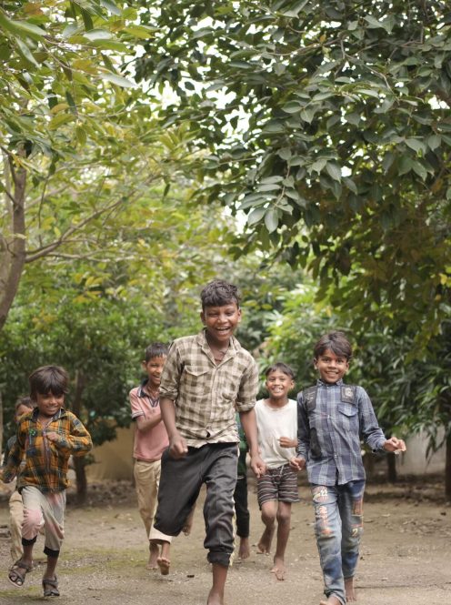 Smiling children supported by MMA Chemicals’ welfare program promoting education and well-being